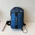 Dark blue athletic crossbody bag with USB charging port and waterproof fabric design - Blue