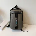 Olive green outdoor crossbody bag with USB charging port and waterproof nylon fabric - Khaki