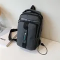 Dark grey multifunctional chest bag with USB charging port and multiple zipper pockets - Gray