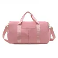 Pink travel duffle bag with wet-dry separation pockets and adjustable shoulder strap - Pink