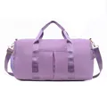 Detail of purple waterproof sports bag with dual handles and adjustable shoulder strap - Violet