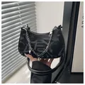 Classic black underarm bag in monogram fabric with pearl heart charms and metal chain - Black