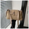 Detail of minimalist khaki crossbody bag showing suede texture and metal buckle - Khaki
