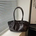 Deep chocolate brown oily wax leather tote bag with glossy pleated finish and long straps - Brown