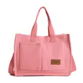 Pink canvas handbag with multi-pocket design and adjustable crossbody strap for women - Pink