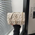 Fashionable beige crossbody bag with geometric quilting and gold tassel metal hardware - White