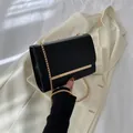 Minimalist black faux leather flap bag with gold metal trim and chain strap - Black