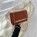 Minimalist chain shoulder bag in brick red leather with golden metallic decoration - Brown