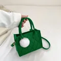 Green felt crossbody bag with rhombus quilting and white fluffy ball charm detail - Green