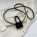 Micro black crossbody lipstick bag in matte tweed texture with a minimalist flap design - Black