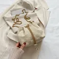 Elegant cream bucket bag with checkerboard texture, gold chain strap and pearl accents - Checkerboard Beige White