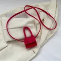 Mini hot pink shoulder bag with high-arched handle and crossbody strap in matte finish - Rose Red