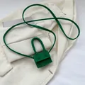 Emerald green suede mini handbag with ring handle and slim shoulder strap - Green