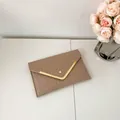 Khaki crocodile pattern envelope clutch bag with gold V-shape metal trim and snap closure - Khaki