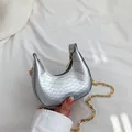 Silver metallic crescent mini crossbody bag with embossed texture and gold chain strap - Silver