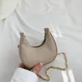 Mini crescent crossbody bag in beige snake embossed faux leather with gold chain strap - Khaki