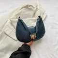 Retro deep blue hobo bag with a golden heart-shaped metal buckle and leather texture - Blue
