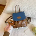 Mini brown leather and blue canvas patchwork backpack with a cute plush bear charm - With Pendant / Blue and Brown