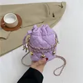 Quilted lavender drawstring bucket bag with gold chain straps and heart pendants - Purple
