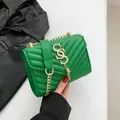 Green quilted faux leather crossbody bag with gold chain strap and stylish tassel detail - Green