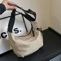 Minimalist khaki crescent crossbody bag with adjustable wide black shoulder strap - Khaki