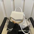 Chic white crossbody bag with crocodile embossed pattern and gold chain decoration - White