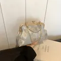 Elegant light blue floral jacquard handbag with gold metal frame and chain strap - Pattern 2 (Gold Maple Leaf)