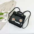 Minimalist black leather backpack with clear display window and vintage metal buckles - Black