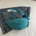 Minimalist cyan blue nylon crescent waist bag with adjustable strap and rope zipper pull - Lake Blue