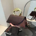 Brown faux leather handbag with crocodile pattern flap and sculpted gold metal handle - Brown