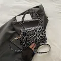 Retro leopard print crossbody handbag with knotted handle and golden hardware finish - Black Leopard