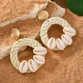 Close-up of bohemian earrings featuring raffia weaving and real cowrie shells - Natural Tone Woven Style (WEH6040)
