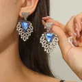 Detail of bohemian gold fan earrings with blue triangular gems and pavé rhinestones - Antique Gold With Royal Blue Triangle Stone (EH3305)