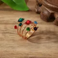 Detail of multi-layer spiral scarf ring with colorful gemstones on a wooden background - One Size / Multicolor (X2370)