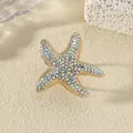 Anello a stella marina dorata con strass colorati su uno sfondo di corallo strutturato - Bianco AB Oro Imitazione