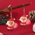 Detailed view of festive Santa Claus earrings with glitter resin on a holiday branch - Cartoon Santa (EH5956)