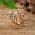Rose gold layered spiral scarf ring with square and round crystals on wood background - One Size / White (X2370)