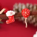 Detailed macro shot of festive red enamel Christmas stocking and snowflake balloon earrings - Asymmetric Stocking Balloon (WEH838)