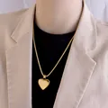 Polished gold heart pendant on snake chain necklace worn with a chic blazer - 50cm / Gold Heart Snake Chain