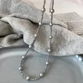 Detail of grey pearl long necklace on knit sweater with adjustable lobster clasp - Grey Simple Pearl Necklace