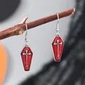 Gothic red coffin earrings with silver cross pendant on wooden branch display - Red Heart Cross Coffin Style (WEH6238)