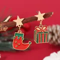 Detail of Christmas stocking and gift box charms on star-shaped stud earrings - Asymmetric Star Sock Box (WEH1801)
