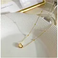 Elegant gold heart pendant necklace with beaded chain on a white ceramic plate - French Minimalist Heart (A0021) / Gold Heart Beaded Chain