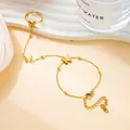 Golden butterfly finger bracelet set with frosted matte finish and beaded chain - Gold