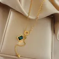 Golden titanium steel necklace with green zircon square stone and letter D charm - Green Square Necklace / Gold