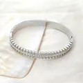 Polished silver titanium steel bangle with double row studs and pavé crystal inlay - Silver