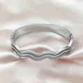 Silver wave bangle with brushed texture and zircon inlay on pink silk fabric - Silver (Z117B)