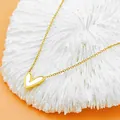 Golden heart necklace with white shell pendant on coral stand with orange background - White Mother-of-Pearl Heart Necklace (X1385)