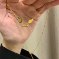 Golden titanium steel necklace with double fish pendant and delicate bead chain - Double Fish Round Bead Necklace (x726)
