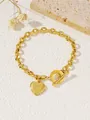 Gouden roestvrijstalen hartjesarmband met letter K en stijlvolle OT-toggle sluiting - Hart Letter K / Goud